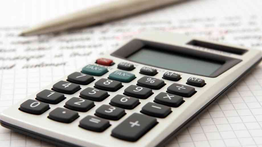 A calculator and a pen and paper.
