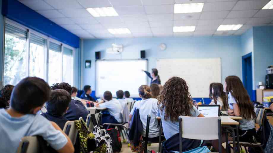 Girl on tablet in classroom Girl on tablet in classroom