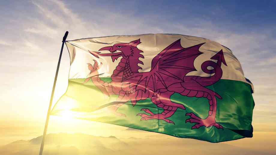 Welsh flag in front of sun. Welsh flag in front of sun.