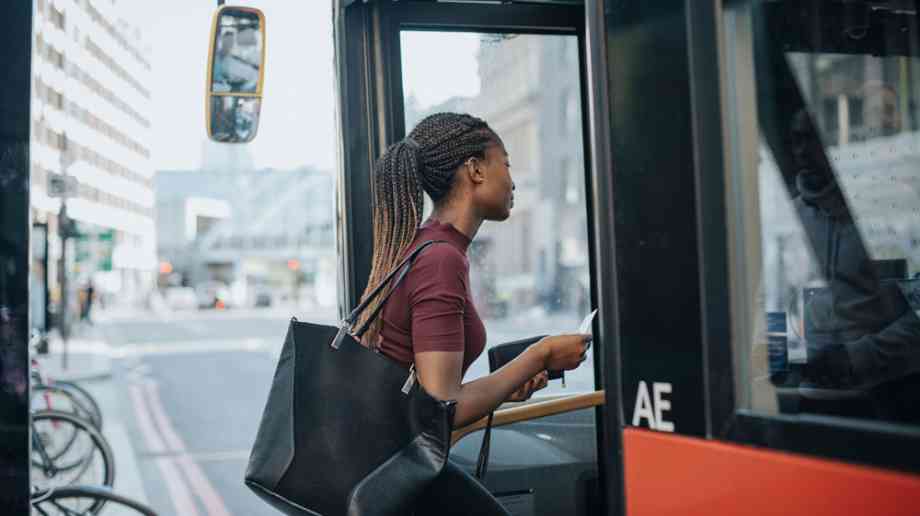 Woman getting on bus Woman getting on bus