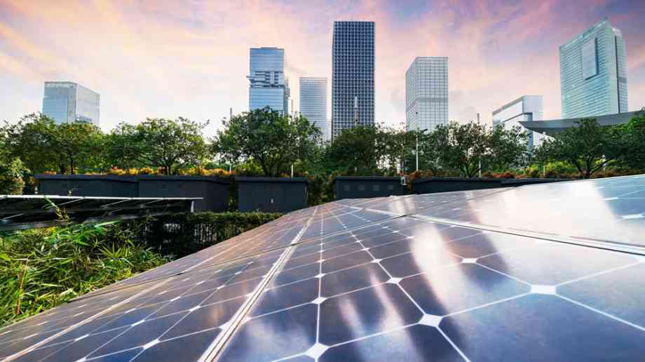 Futuristic cityscape with solar panels in foreground. Futuristic cityscape with solar panels in foreground.