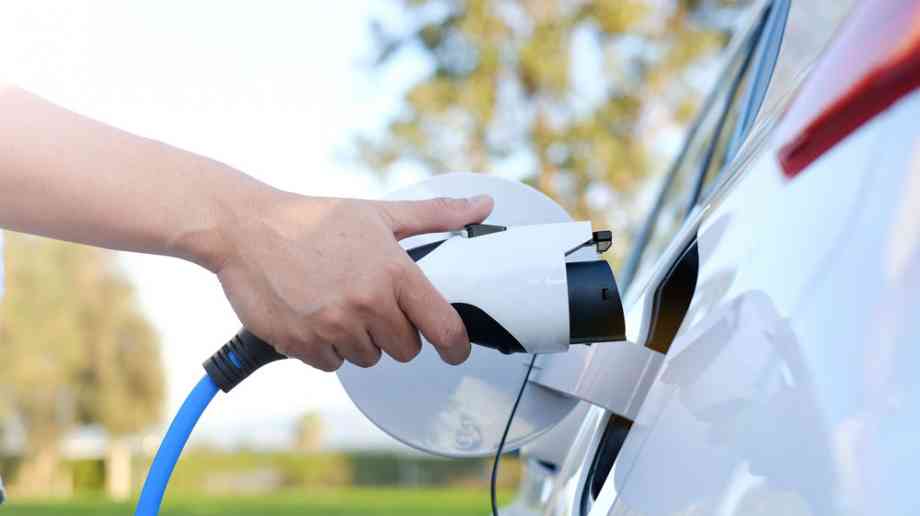Person charging electric car