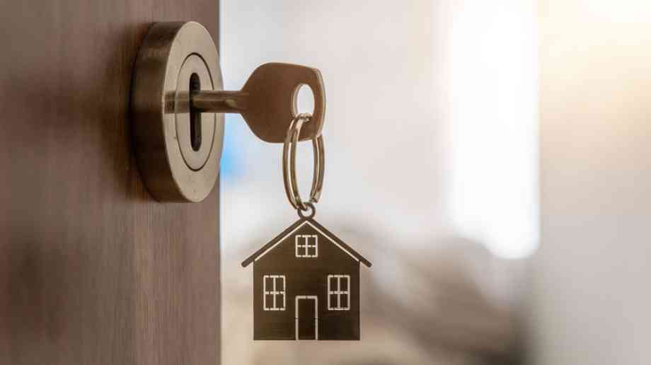Key in door of house