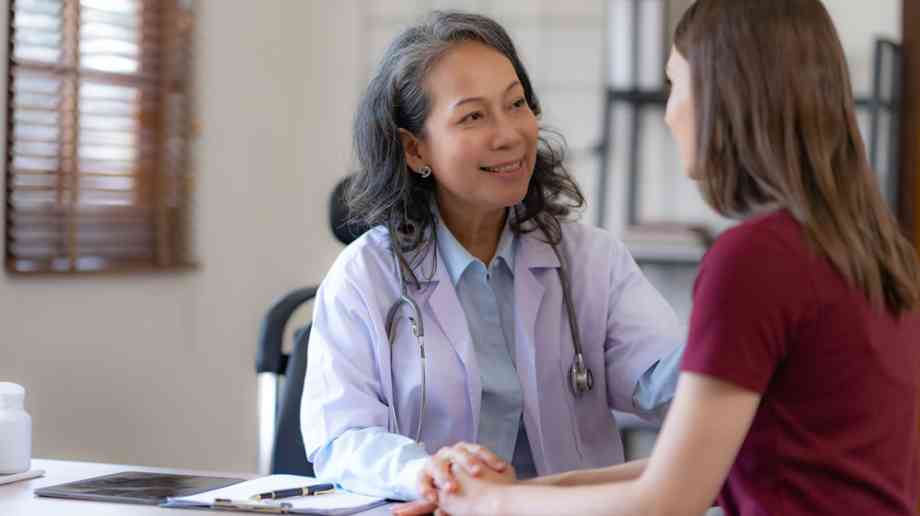 Doctor and patient at a GP surgery.